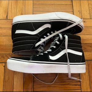 Black and white high top Vans